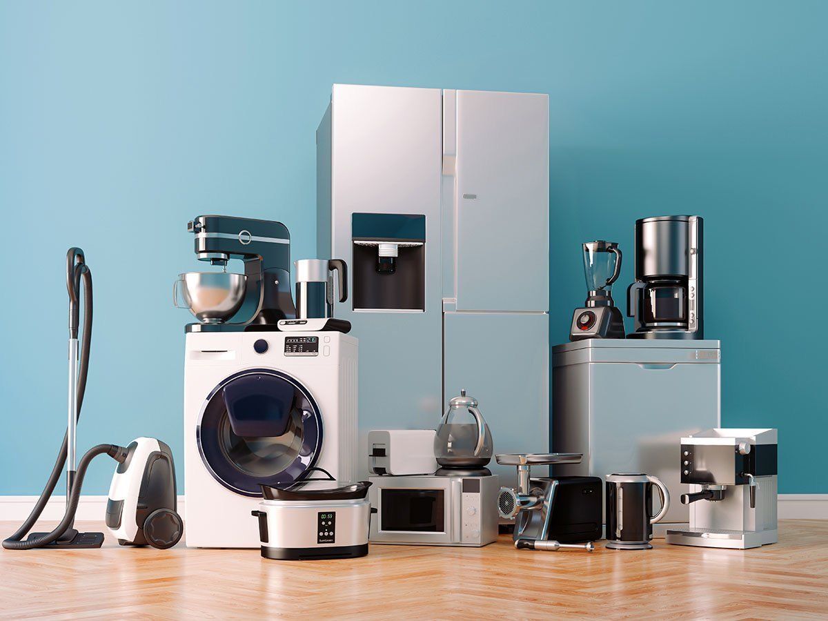 Kitchen appliances including a cooker, kettle, blender and coffee machine